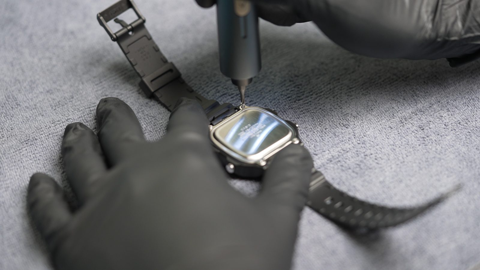 Removing the four caseback screws from the Casio AE-1200